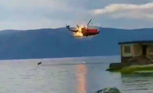 Fire Fighting helicopter crashed into Erhai Lake, china with flames , killing  all four occupants while was trying to fetch water for the firefighting operations.