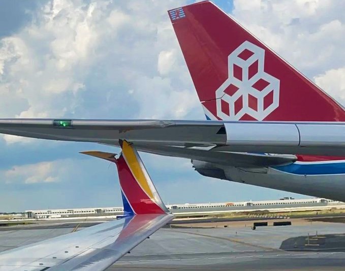16 years old Southwest B737-700 aircraft was hit by a 9 years old Cargolux B747-8F in the act of taxiing at Chicago-O'Hare Intl Airport.