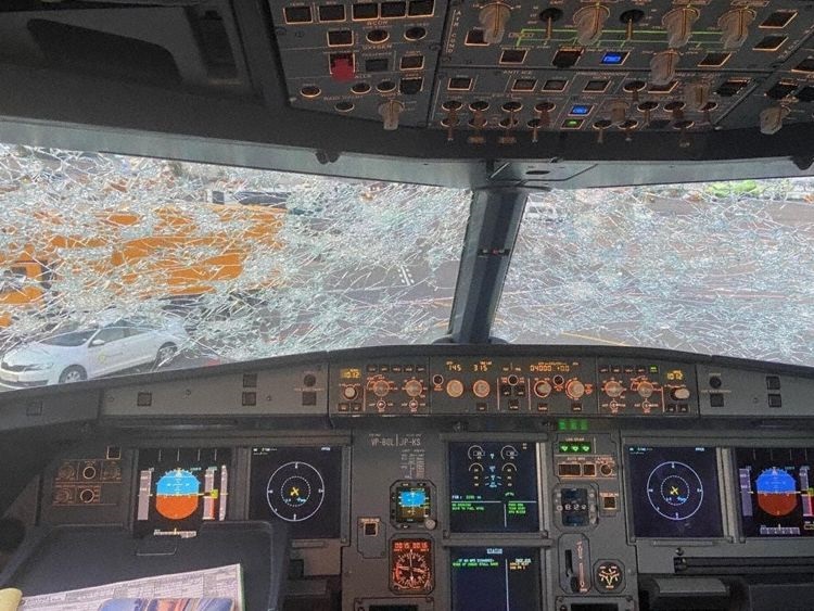 7.2 years old Sibir Airlines ( S7 ) A320-214 aircraft encounters Hail storm while Climbing , Multiple cracks on Both the Windshields , Radome damaged !